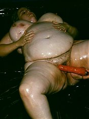 Naughty BBW covered in goo while a horny guy examines her big fat tits and enormous booty live